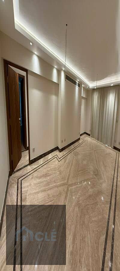 Super deluxe apartment with a luxurious garden for sale, fully equipped with a kitchen and appliances, and air conditioning, in Galleria Golden Square