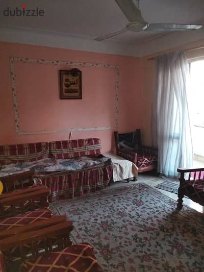Furnished air-conditioned apartment for rent, room and living room, kitchen, bathroom, fourth floor, upper level. All facilities are available: water, electricity, and elevator within a secured compound with 24-hour security. Swimming pools available; a private garden in Alexandria, Al-Ajmi, kilo 21, on the Beach of Al-Nakhil in a very distinguished location.