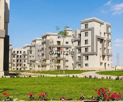 Ground-floor apartment with a garden for sale in the Cairo University Compound (Dahshur Link Road); immediate handover, semi-finished.