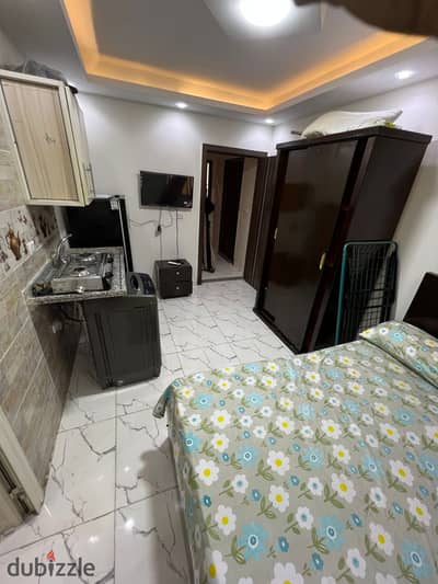 Furnished studio for rent in October, First District, including water, steps to the parking lot, Al-Hosari, and the university.
