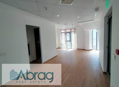 Commercial building for sale, fully finished, with returns from day one, in a prime location in Courtyard Mall, Sheikh Zayed.