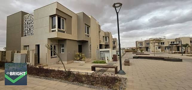 For sale in Badya Palm Hills: a corner townhouse in a prime location, priced below market value. Offered in "core and shell" condition with immediate