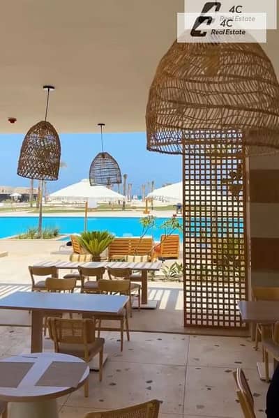 باقل من سعر الشركه شاليه ريسيل كورنرتشطيب كامل Direct Lagoon View ريسيل في سي شور الساحل الشمالي بتقسيمه مميزة-جاهز للمعاينه و الاستلام