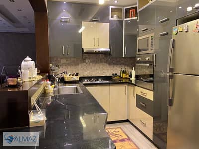Furnished apartment with a super deluxe finish, 160 square meters, for rent in the American University Housing District in New Cairo.