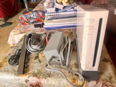 Wii بمشتملاته و العاب و كونترولر كالجديد