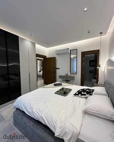 Apartment for sale in Sheraton, featuring high-end hotel-style finishing, air conditioning, and a kitchen; located right next to City Centre Almaza