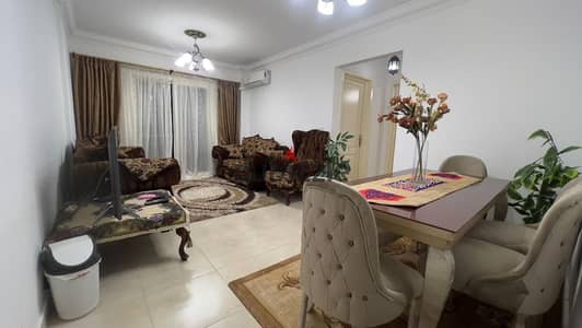 Furnished apartment for rent in Madinaty (B12), middle floor; features two bedrooms and a bathroom.