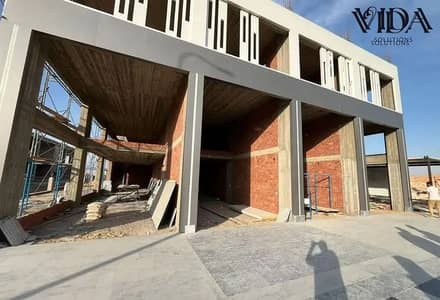 for sale retail shop 210 sqm in the Eastern Expansions area near the 26th of July Corridor Cairo Palace Mall with Ready to move
