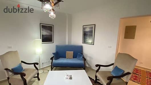 Furnished apartment for rent in Madinaty (Phase 2, mid-floor); features 3 bedrooms and 2 bathrooms, located near the Open Air Mall.
