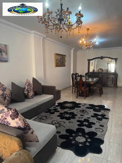 Furnished apartment for rent in the Fourth District, 6 October, next to Royal International School, consisting of three bedrooms and a reception, 2 bathrooms, one of which is a master with the bedroom, fully air-conditioned kitchen, Wi-Fi, natural gas, third floor, elevator, distinguished and upscale location, large area of 220m