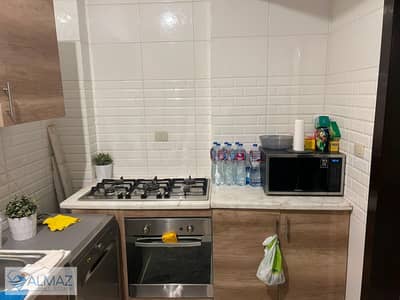 Unfurnished apartment with a kitchen for rent in the American University Housing neighborhood, Fifth Settlement.