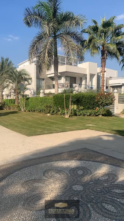 For Sale, the largest Twin Villa available in Sheikh Zayed, directly on the main axis, in front of Arkan Plaza, next to Swan Lake