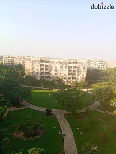 96 sqm apartment with custom finishes and an open garden view, available for rent unfurnished in Madinaty (B7).