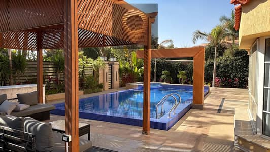 Villa 790 sqm for sale in Madinaty with a private pool, luxury finishes, and a wide garden view
