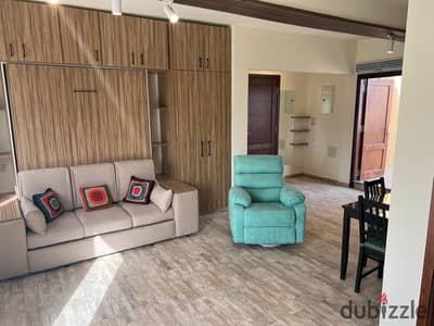  Fully Furnished Studio for Annual Rent – Stone Residence | Fifth Settlement   Studio Area: 49 sqm   Private Rooftop: 68 sqm   Fully Furnishe
