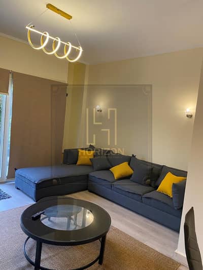 Furnished Modern Studio with garden for rent in The Village New Cairo
