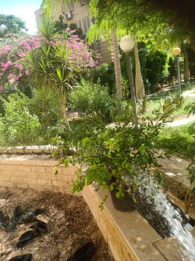Apartment for rent in Opera City Compound, Sheikh Zayed; features a private garden, full air conditioning, a prime location, and a wonderful view.
