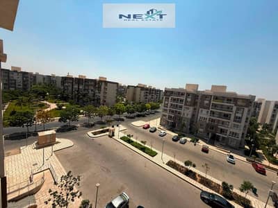 For sale in Madinaty (Cash): An 85m² apartment in B12—an exceptional deal. Features an open view and a "Police Allocation" unit. Located very close to