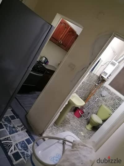 Furnished apartment for rent, natural gas available, air conditioning in the reception. The apartment consists of three bedrooms, a bathroom, a kitchen, and a reception. Location: Maadi.
