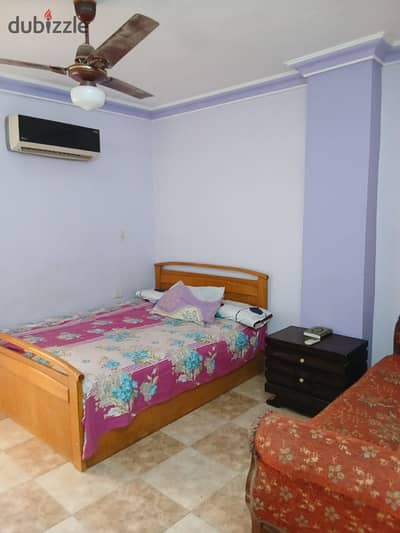 Furnished apartment for rent in Sheikh Zayed, District 1 (Neighborhood 5); elevated ground floor, located on a main street.