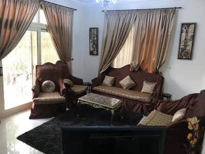 Furnished apartment for rent in Opera City Compound, Sheikh Zayed. Features include a kitchen, air conditioning, and a garden, all in a prime location