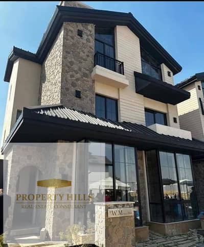 Villa in a very upscale and distinguished compound with buildings available for installment over 12 years, finished with ultra super lux finishing