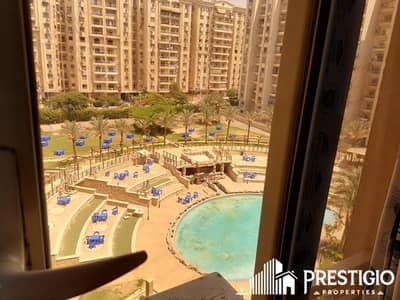 Apartment for sale, 205sqm, in Maadi Grand City compound, direct view of the club, super lux, 2 garage spaces, furnished, and equipped with ACs