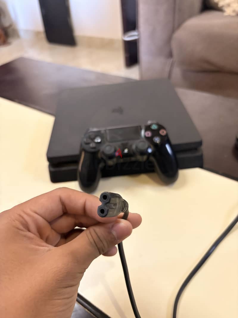 PlayStation 4 slim used ksa version 4 games 4