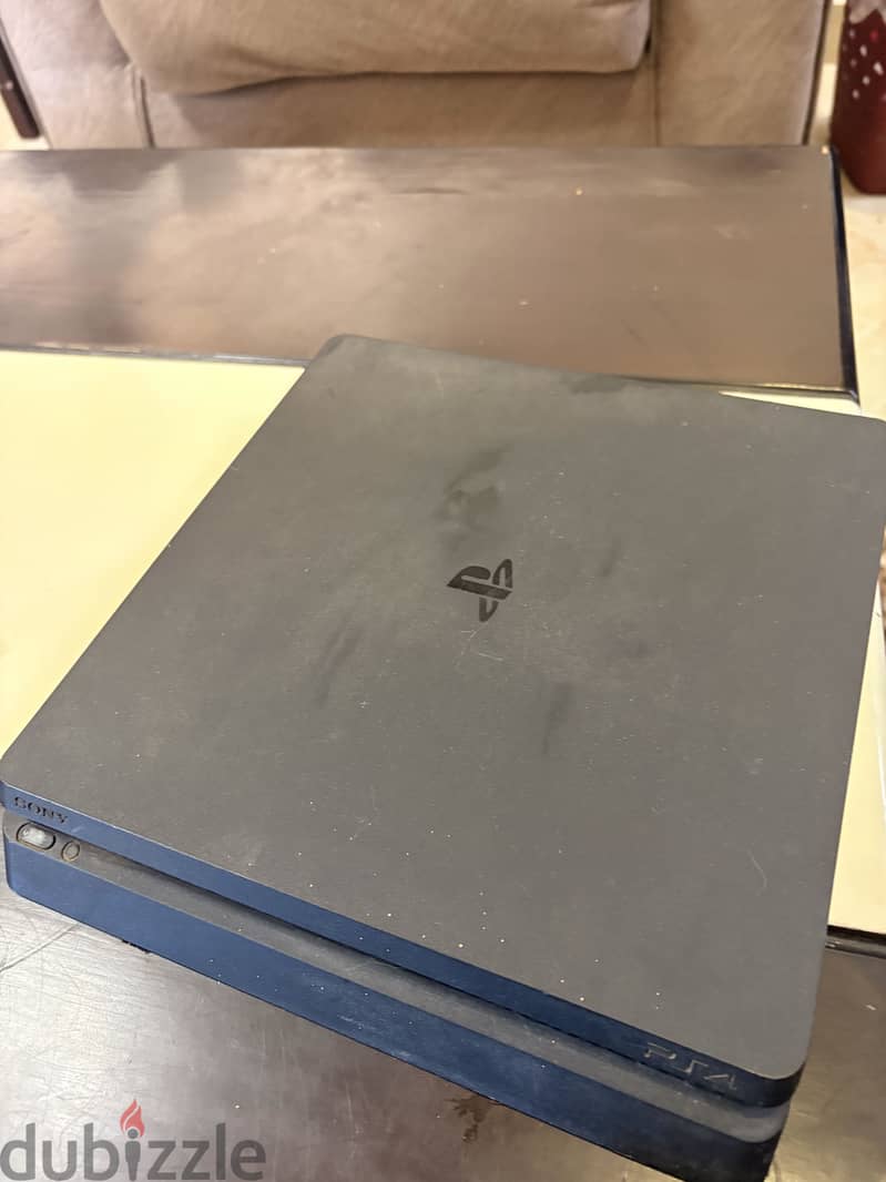 PlayStation 4 slim used ksa version 4 games 5