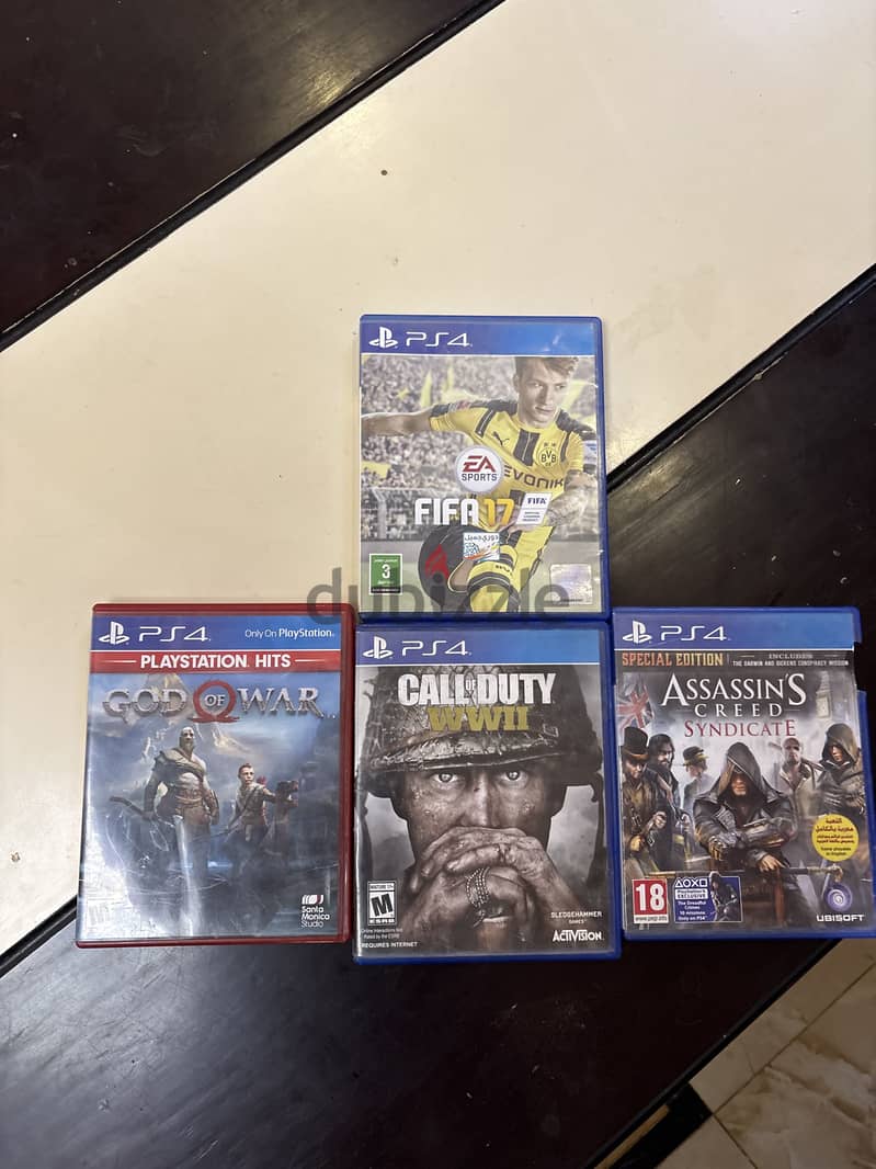PlayStation 4 slim used ksa version 4 games 2