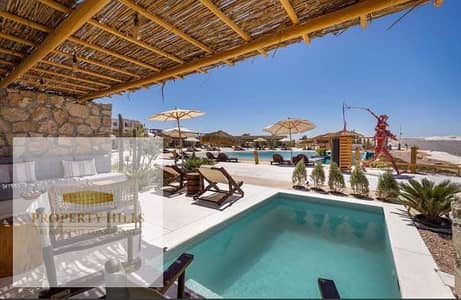 At the lowest price in the market, Standalone Chalet in Joun Soudic, the most luxurious village in the North Coast, turquoise water in Ras Al-Hekma, minutes from Marassi and Hacienda West.
