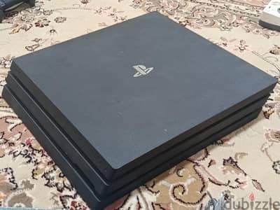 PS4 PRO 1TB with 14 game discs and 2 original controllers