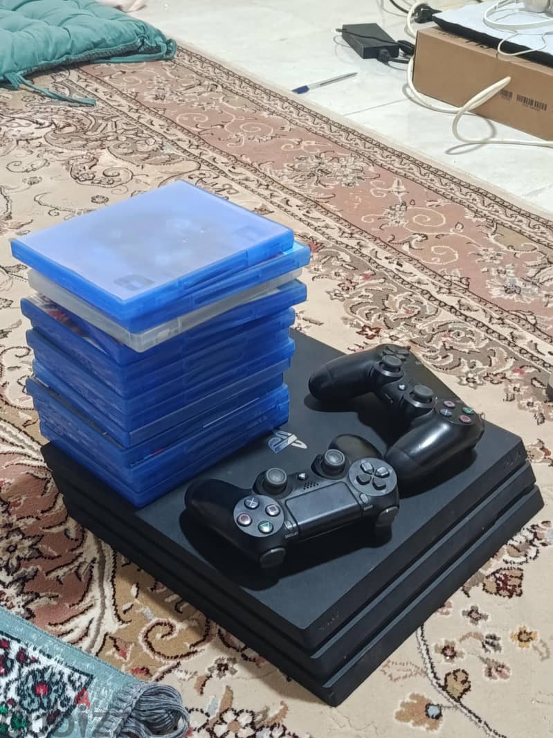 PS4 PRO 1TB with 14 game discs and 2 original controllers 2