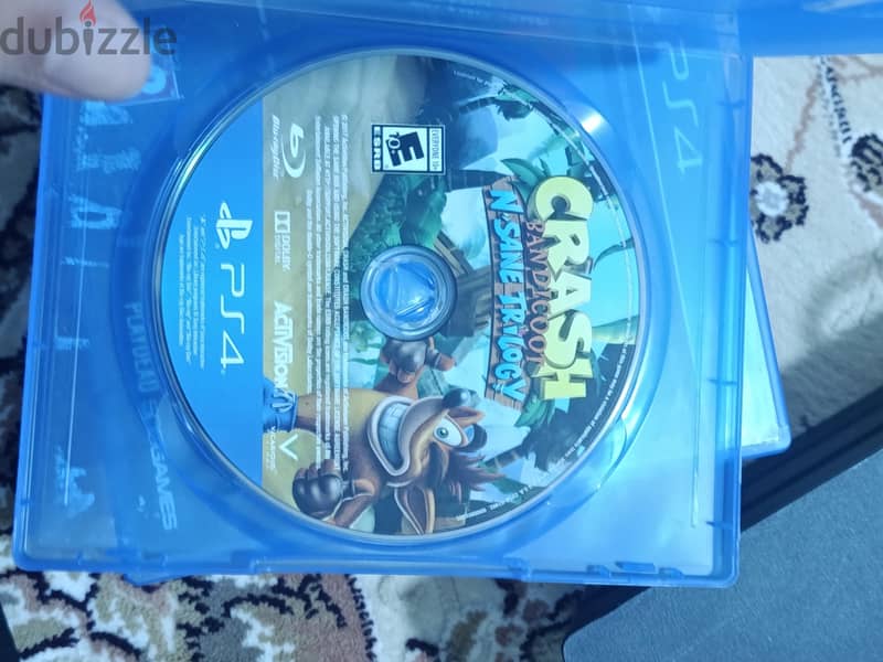 PS4 PRO 1TB with 14 game discs and 2 original controllers 12