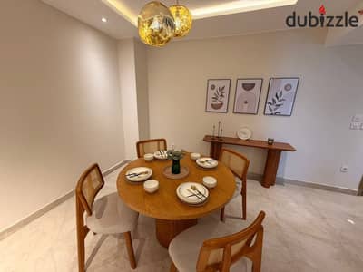 2BR corner apartment with open landscape views in a prime Suez Rd location near Madinaty & AUC 12year interest-free installments