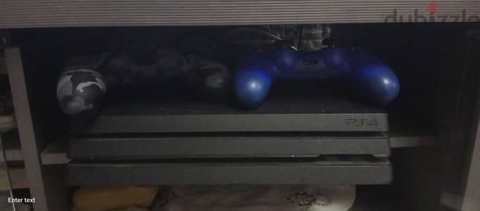 playstation 4 pro, two controllers