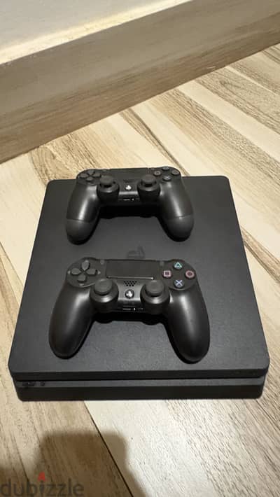 Ps4 slim 500gb with 2 original controllers and 4 games