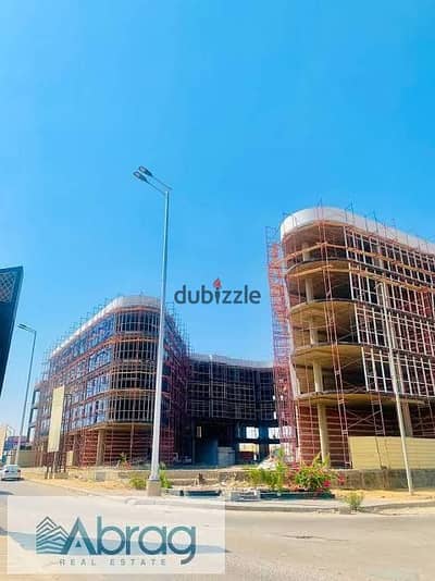 عيادة 52م للبيع في VAL Plaza على محور 26 يوليو – فيو بلازا، مساحة مفتوحة قابلة للتقسيم، استلام فوري، شامل الصيانة وباكية الجراج