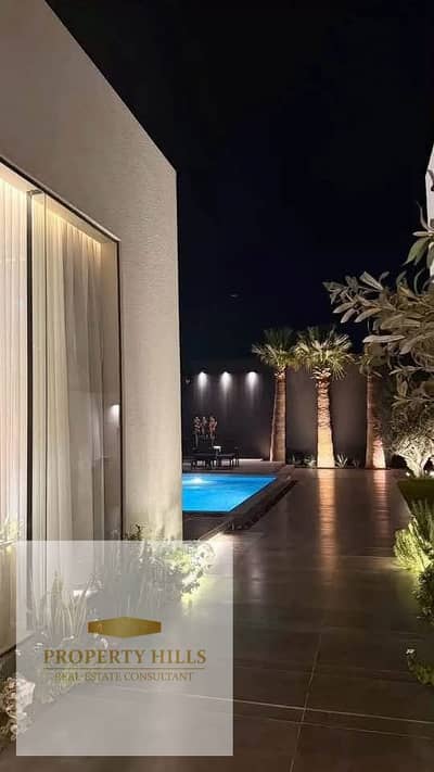 Villa for Sale with a Private Lake View in an Exclusive Villas-Only Compound in the Golden Square, next to Mivida and Palm Hills.    The villa consist