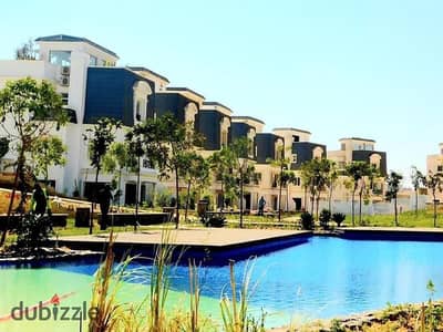 Townhouse for sale in Mountain View Chillout Park; ready for handover, featuring a distinctive view overlooking the landscape and a lake.