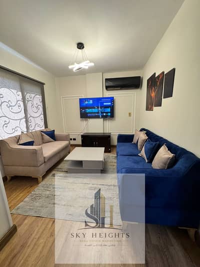 Furnished two-bedroom ground-floor apartment for rent in Al Rehab City.