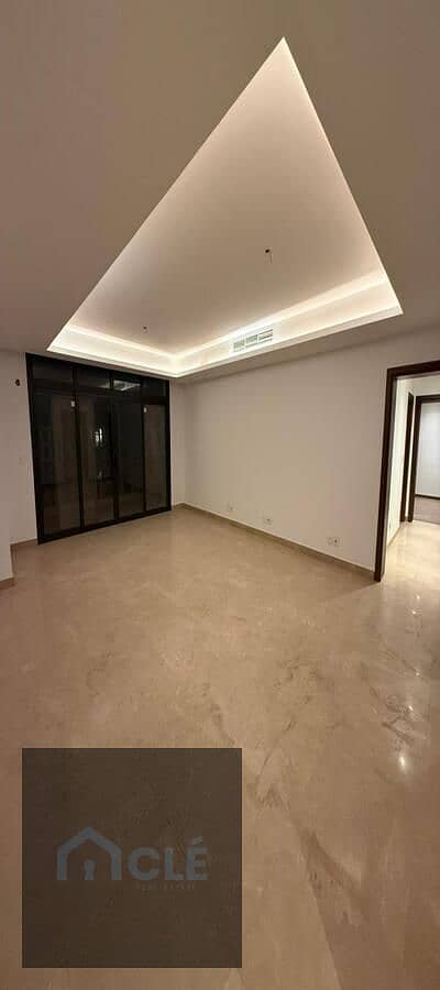 Luxury semi-furnished apartment (including kitchen and A/C units) for rent at a competitive price in the Aura phase of Cairo Festival City, New Cairo.