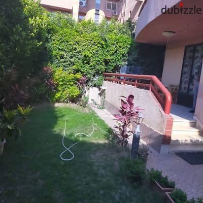 For sale in Al-Rehab, a ground floor apartment with a garden (119 m + 55 m garden) overlooking a high hill