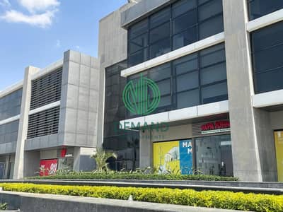 Shop 62 sqm for rent in West Mark Strip Mall, directly on 26 july Axis, in front of Nile University