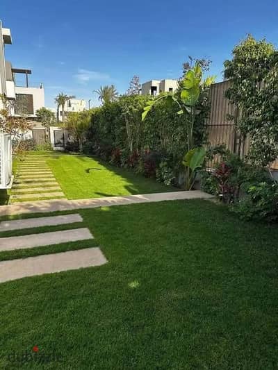 Ground floor 318 sqm apartment with private garden and open greenery view instant discount on Suez Road near AUC The Spine Towers Madinaty