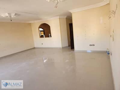 Unfurnished 200-square-meter apartment for rent in Al-Banafseg 10 (Villas Zone), First Settlement, facing the Waterway complex.