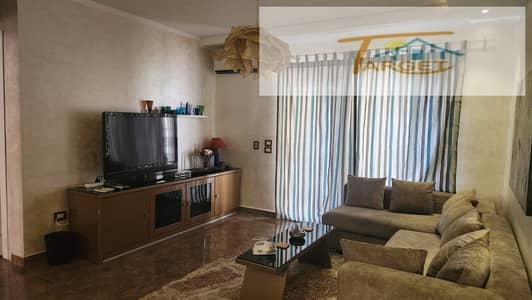 Furnished apartment for rent in Madinaty: 90 sqm ground-floor unit with a 55 sqm garden. Features 2 bedrooms, custom finishes, modern furniture, and f
