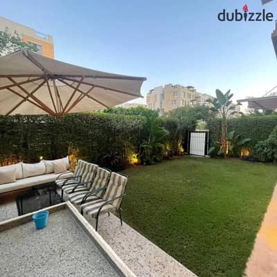 Ground floor 318 sqm apartment with private garden and open greenery view instant discount on Suez Road near AUC The Spine Towers Madinaty