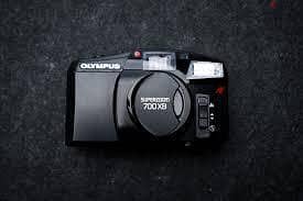 للبيع كاميرا فيلم Olympus Superzoom 700XB بزوم
