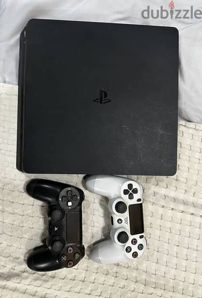 PS4 Slim 500GB + 2 Original Controllers – Good Condition